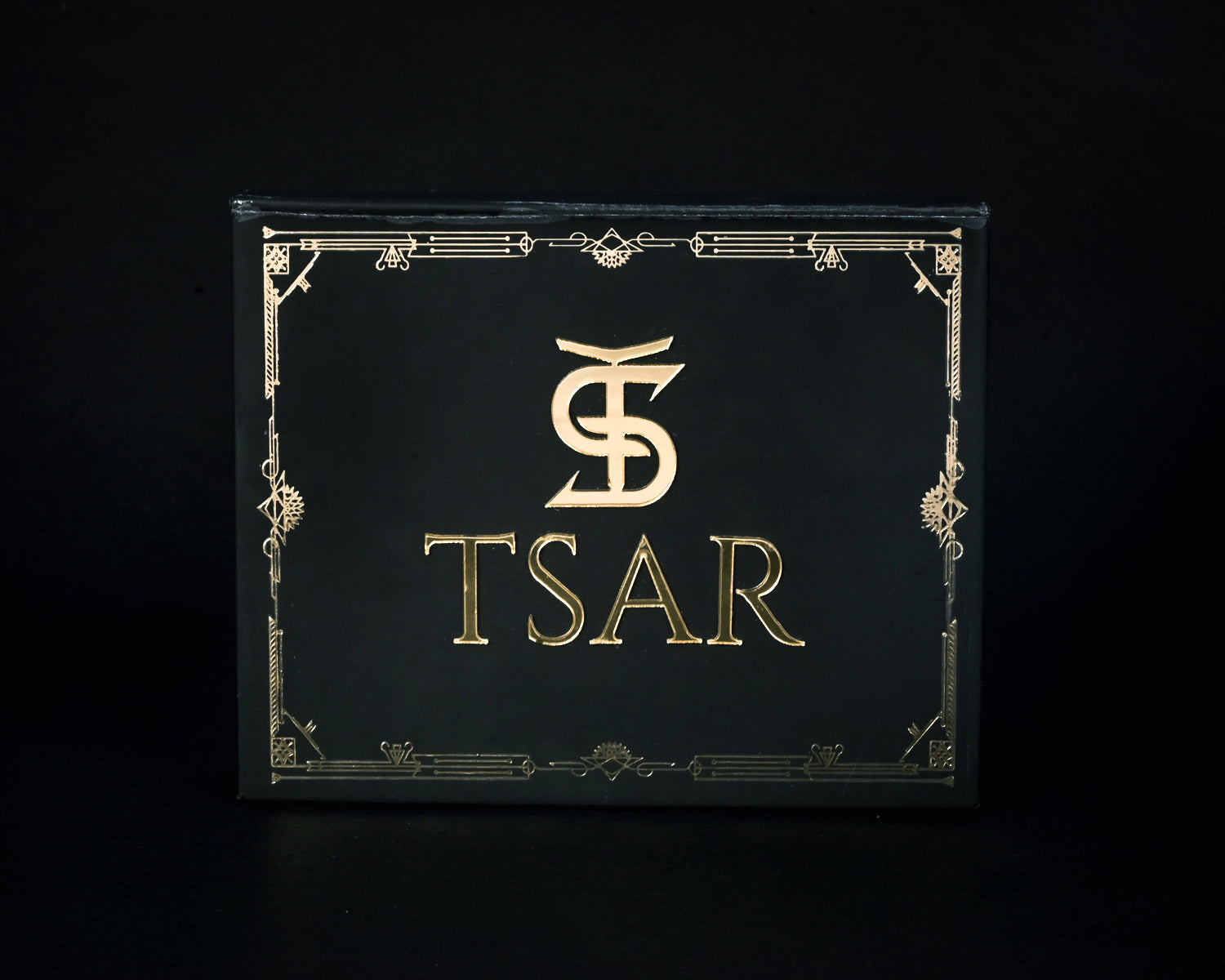 Black box with gold 'TSAR' logo on a black background