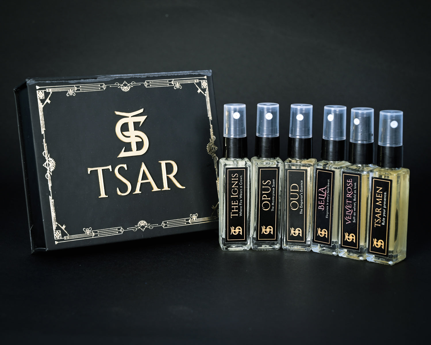 TSAR perfume set with bottles and packaging on a black background